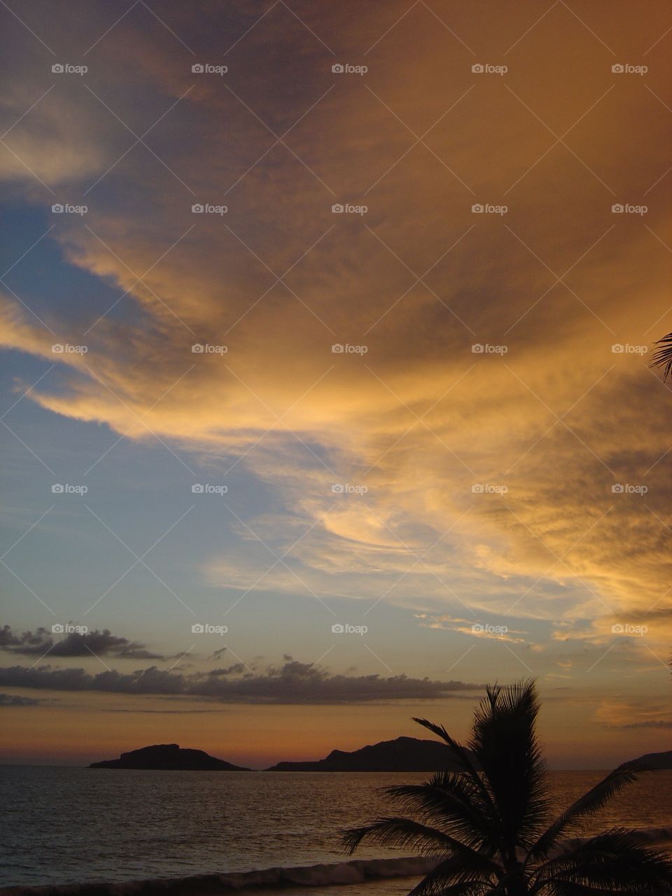 Idyllic view of sea at sunset