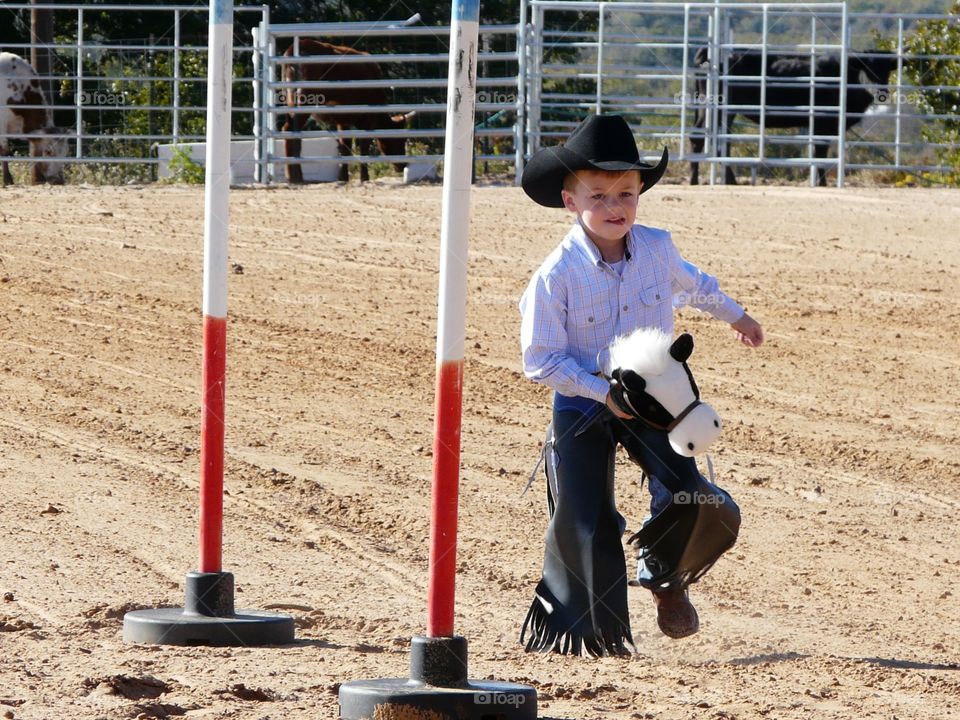 Boy wearing cowboy costume