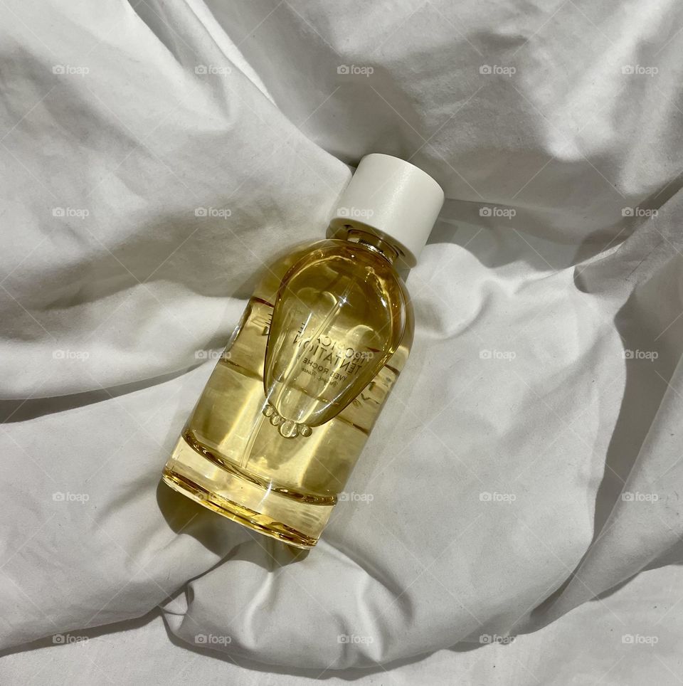 Women perfume on the bed