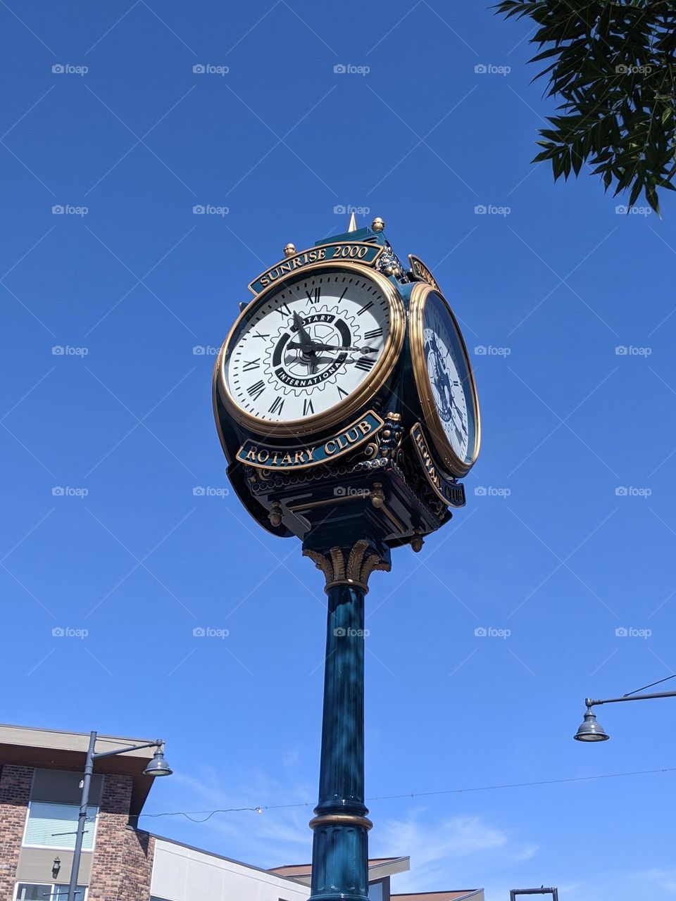 a vintage Rotary club clock set on a lamp post at townsquare