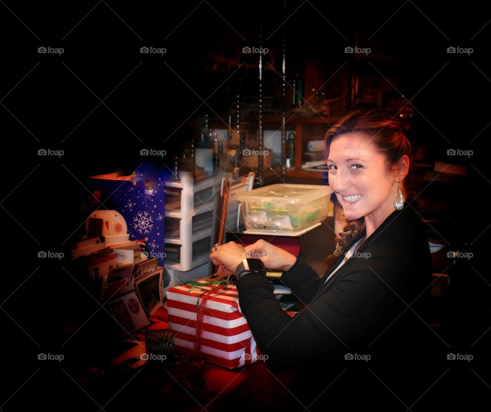 Smiling girl wrapping presents