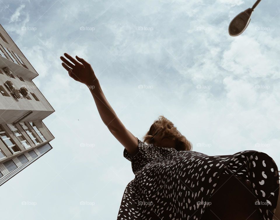 girl in the city against the sky