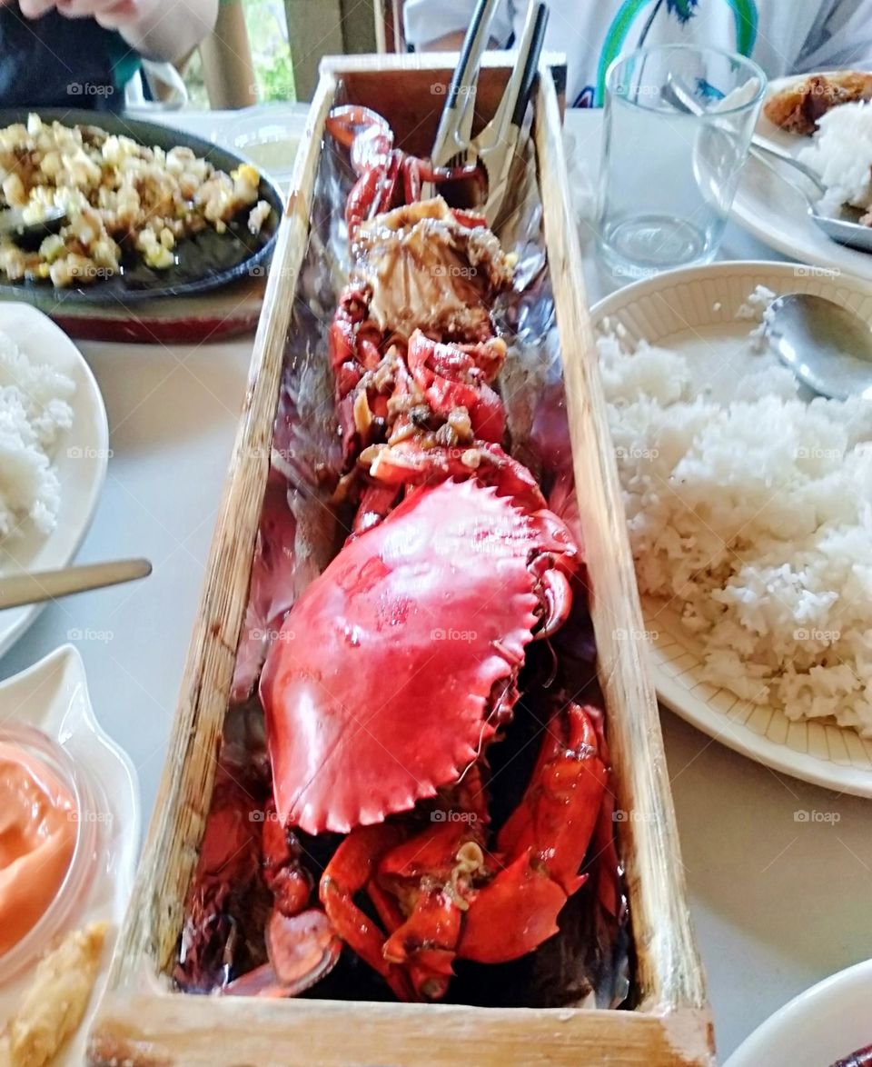 Eco-friendly Woodenware; sustainable food server rectangular bowl with steam crabs.