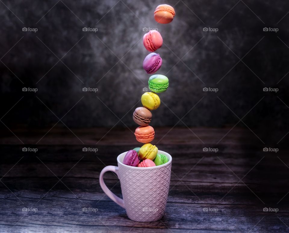 Colorful macaroons in cup 