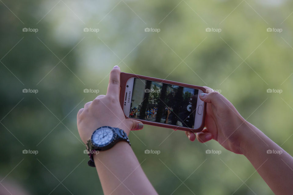 Working hands taking a photo