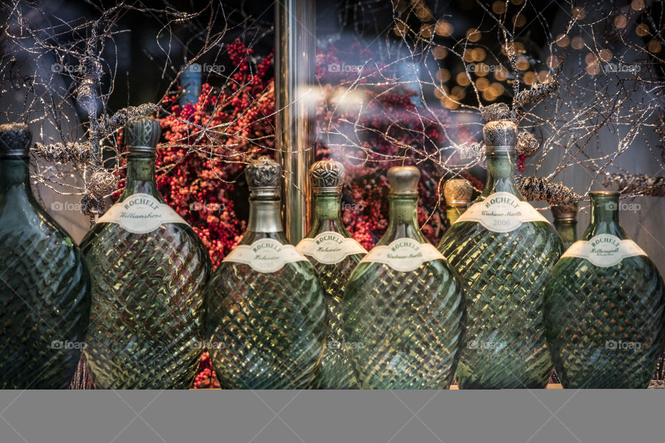 retro glass bottles through a window on a winter day with soft light and warm colours