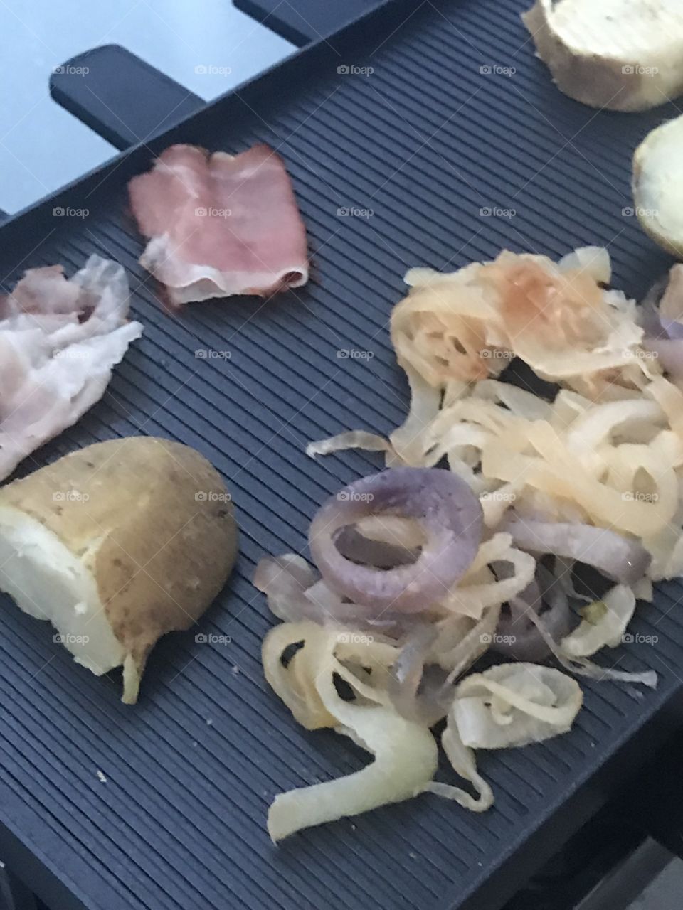 Racclette, cheese, melted, Switzerland, capers, prosciutto, French, feast, good eating, gourmet, delicious, racclette grill, Crusty bread, sweet pickles and meats, anti-pasta, Grilled onions, potatoes, pork, Backyard, friends, gathering, culinary