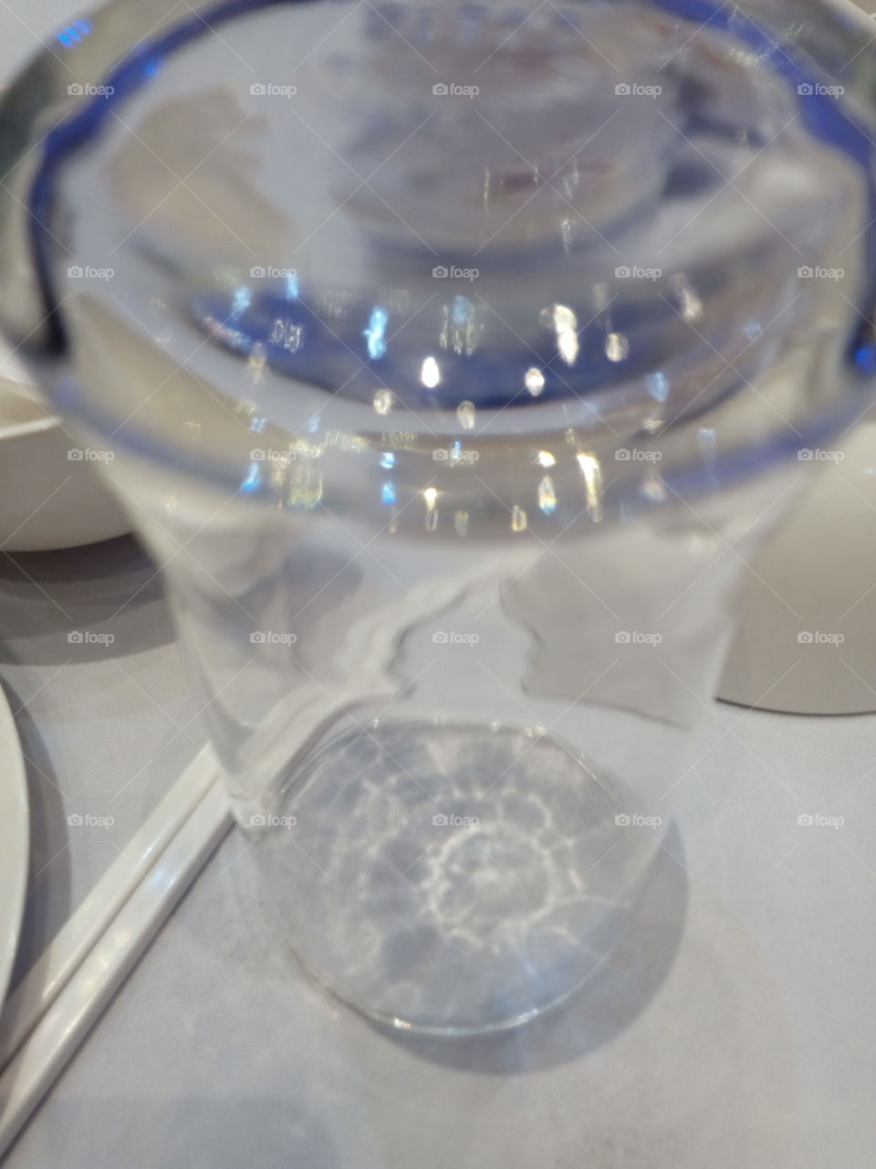 The glass on the table.