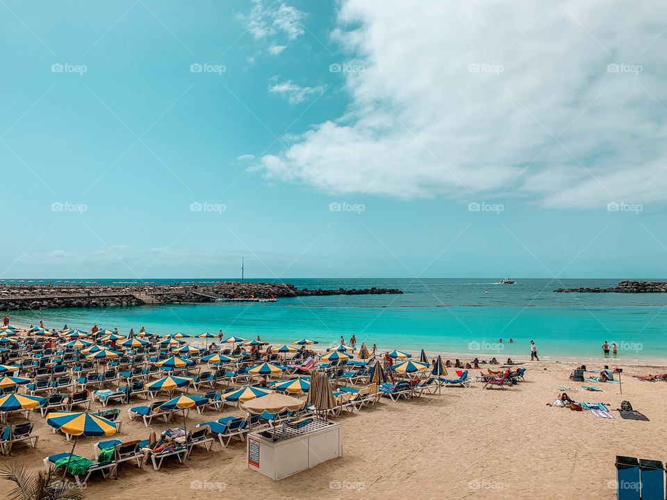 Touristic beach in summer during day 