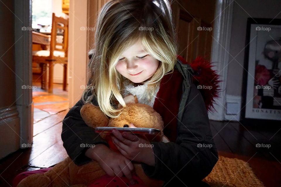 Girl watching on a smartphone