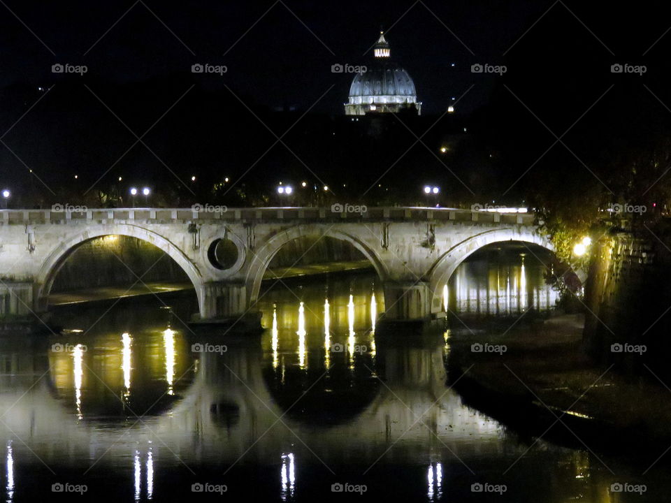 saint Peter dome and reflection view  from the tiber  bridge by night
