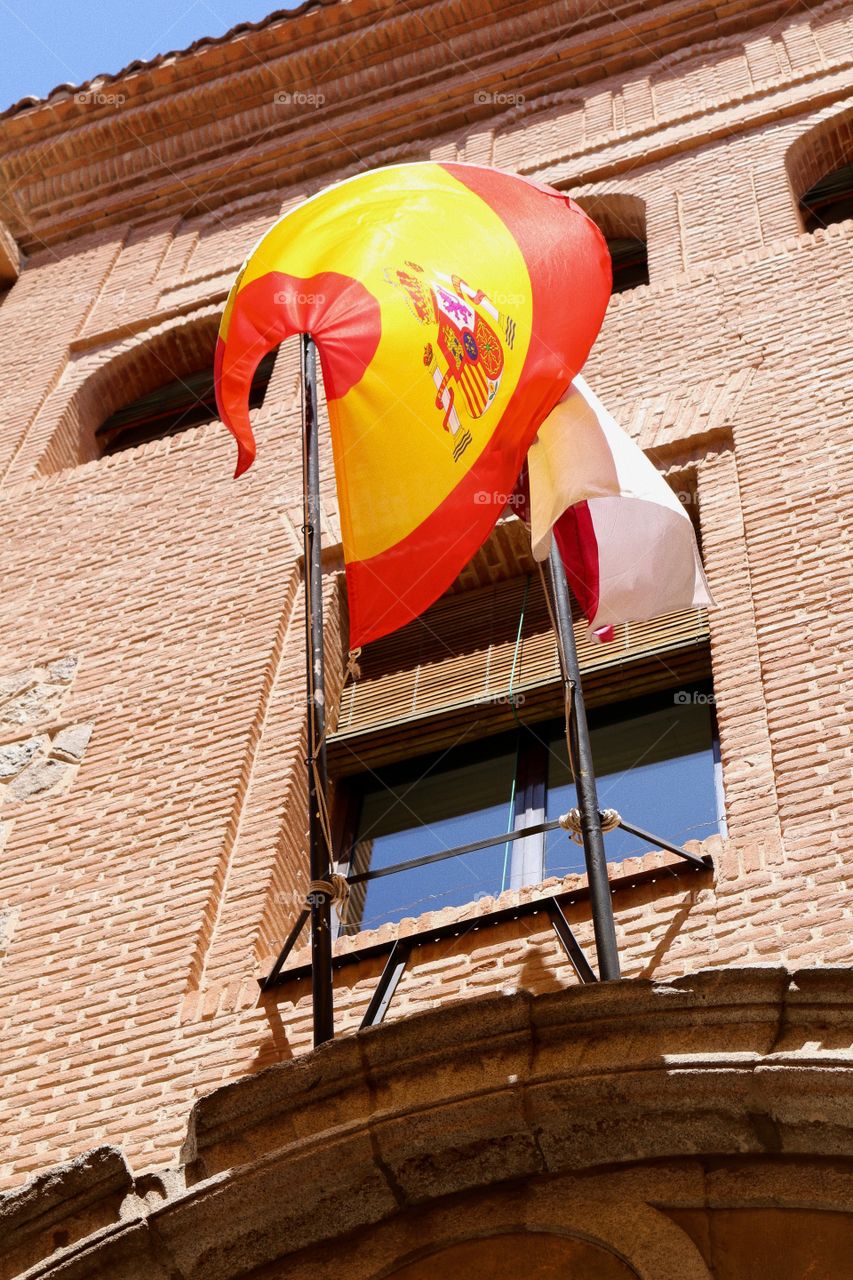 Spanish flag flying in Toledo, Spain.