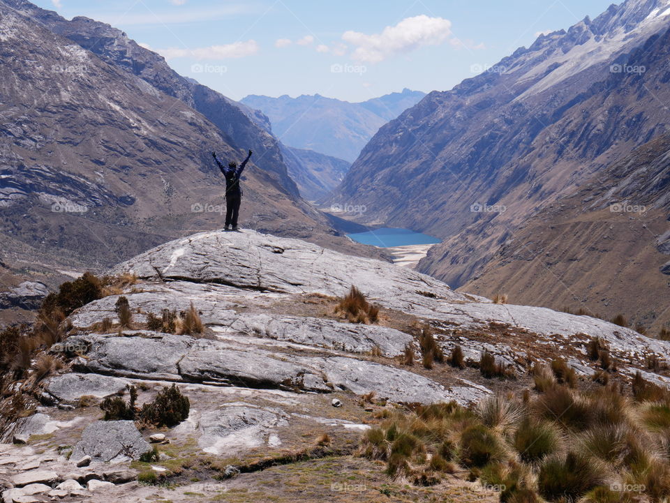 Woman achieving her hiking goal in Peruvian mountains