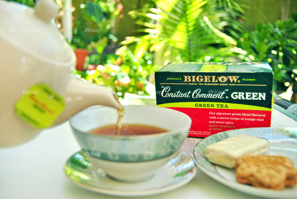 Pouring Green Tea Bigelow tea for breakfast