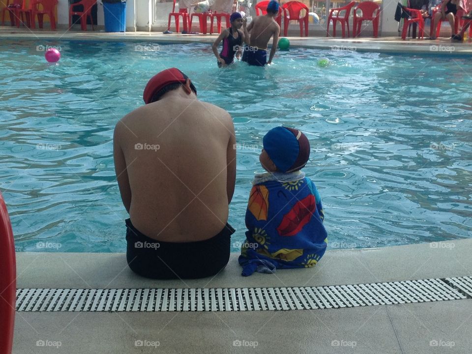 Dad and son . Dad and son at the swimming pool 