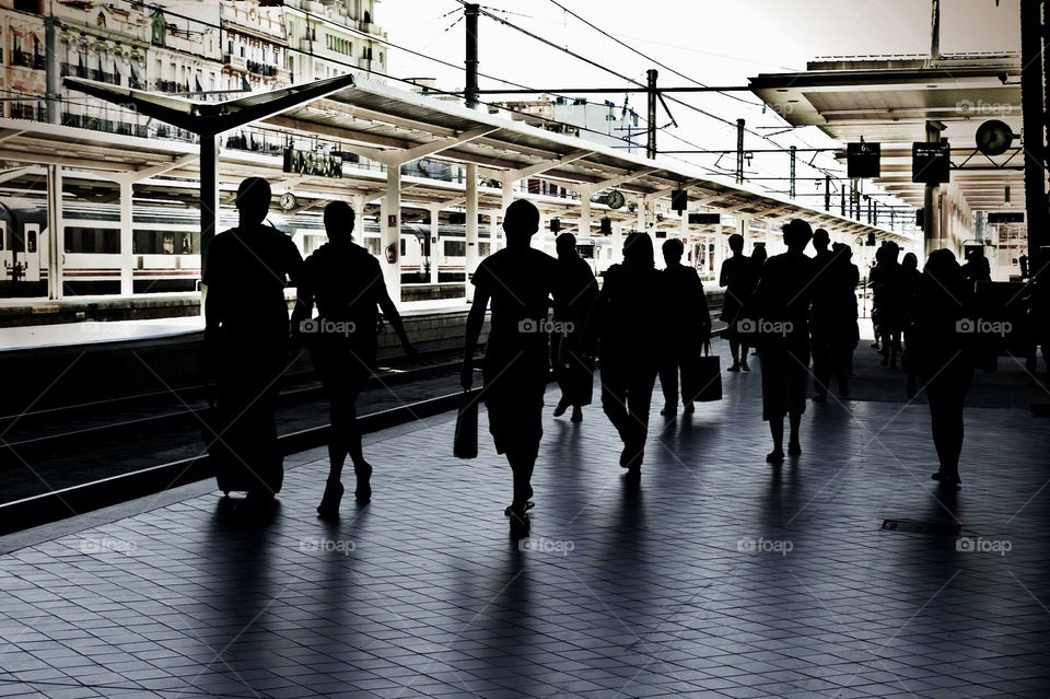 people train station walking by ventanamedia