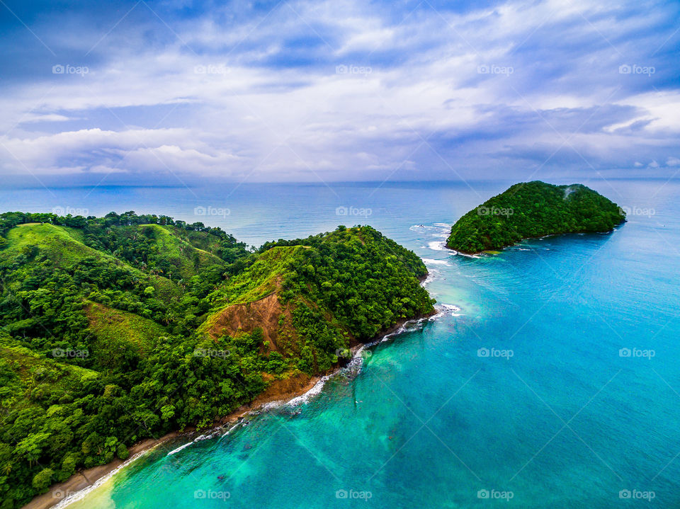 Beautiful scenic beach on the coast of Costa Rica. Very surreal. Beautiful colors and islands 