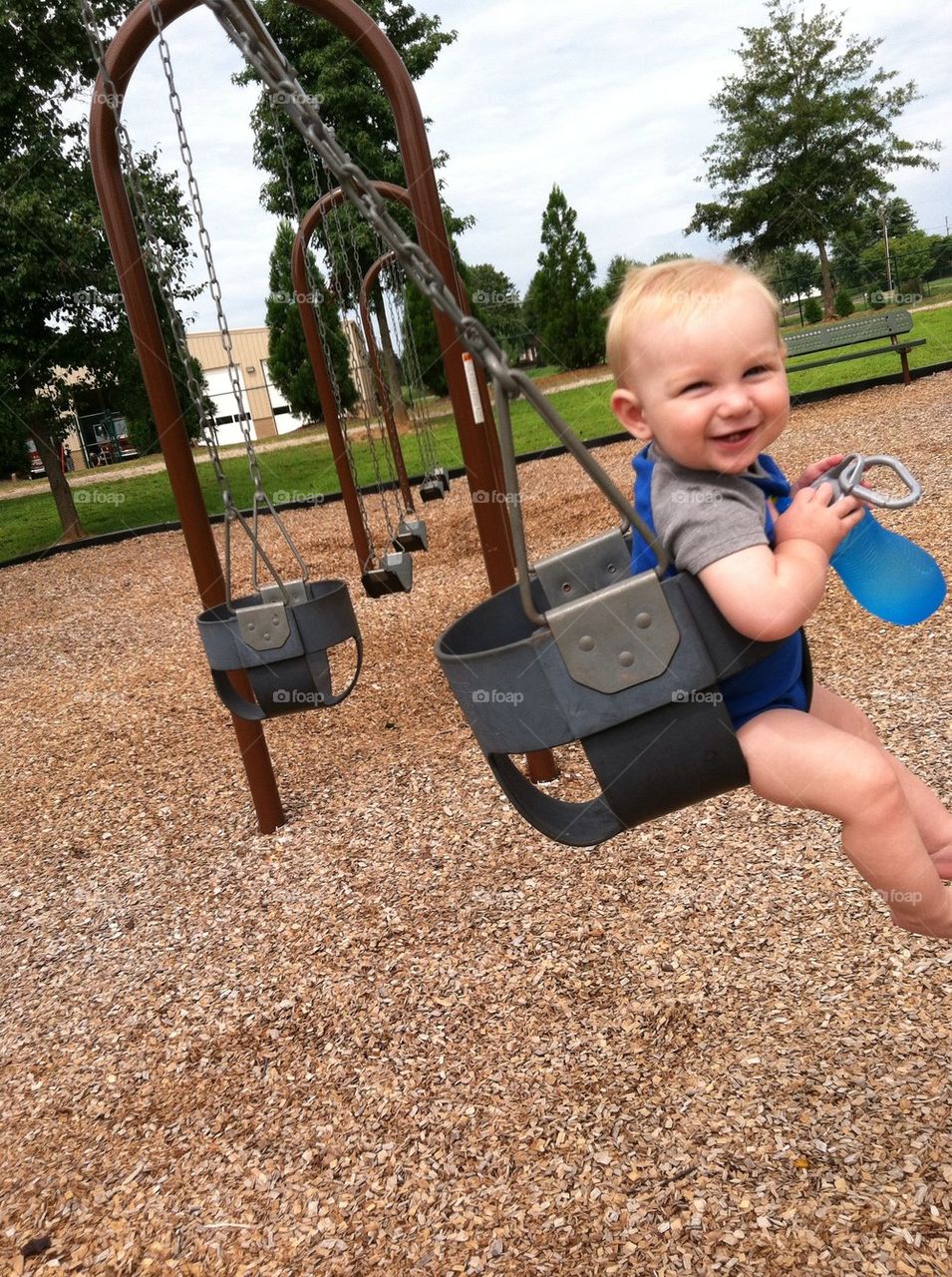 A cutie in a swing