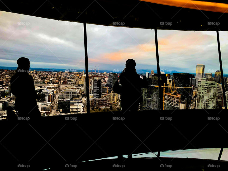 Looking out at the windows of the space needle 