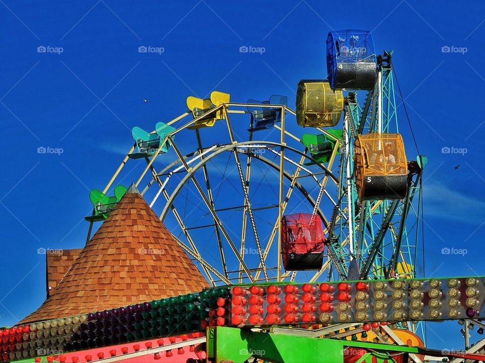 Ferris wheel and thrill ride at a California amusement park