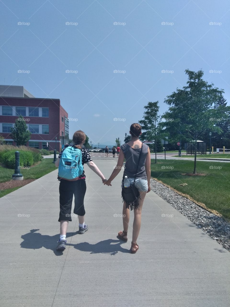 Student with Autism and mentor hold hands at University of Vermont