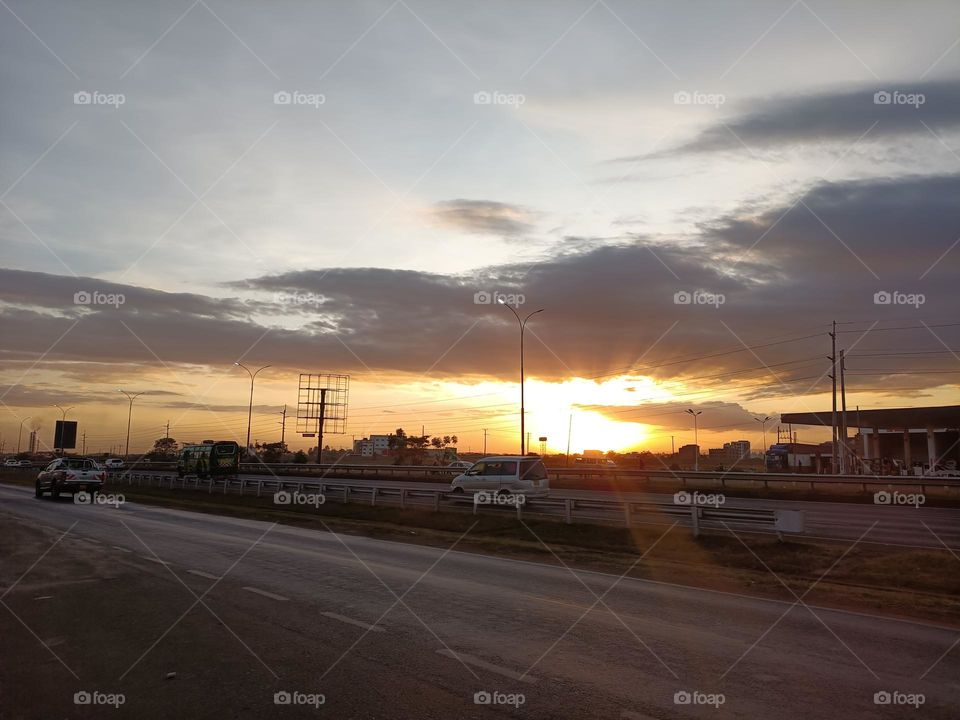 sky sunset Transportation Cloud Road mode of transportation Nature dawn car evening street motor vehicle Architecture Afterglow City horizon Dramatic sky no people environment built structure