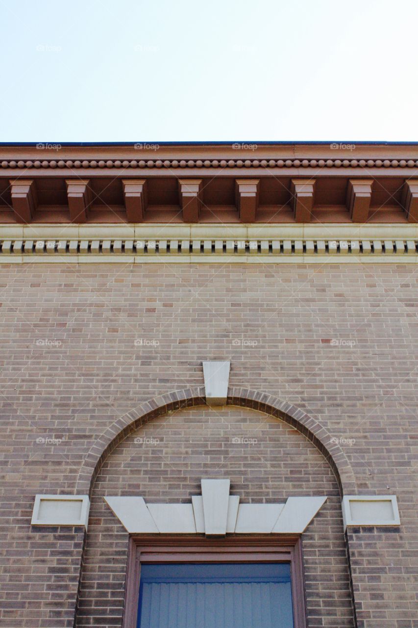 Architectural detail on the overhang and side of an historical building