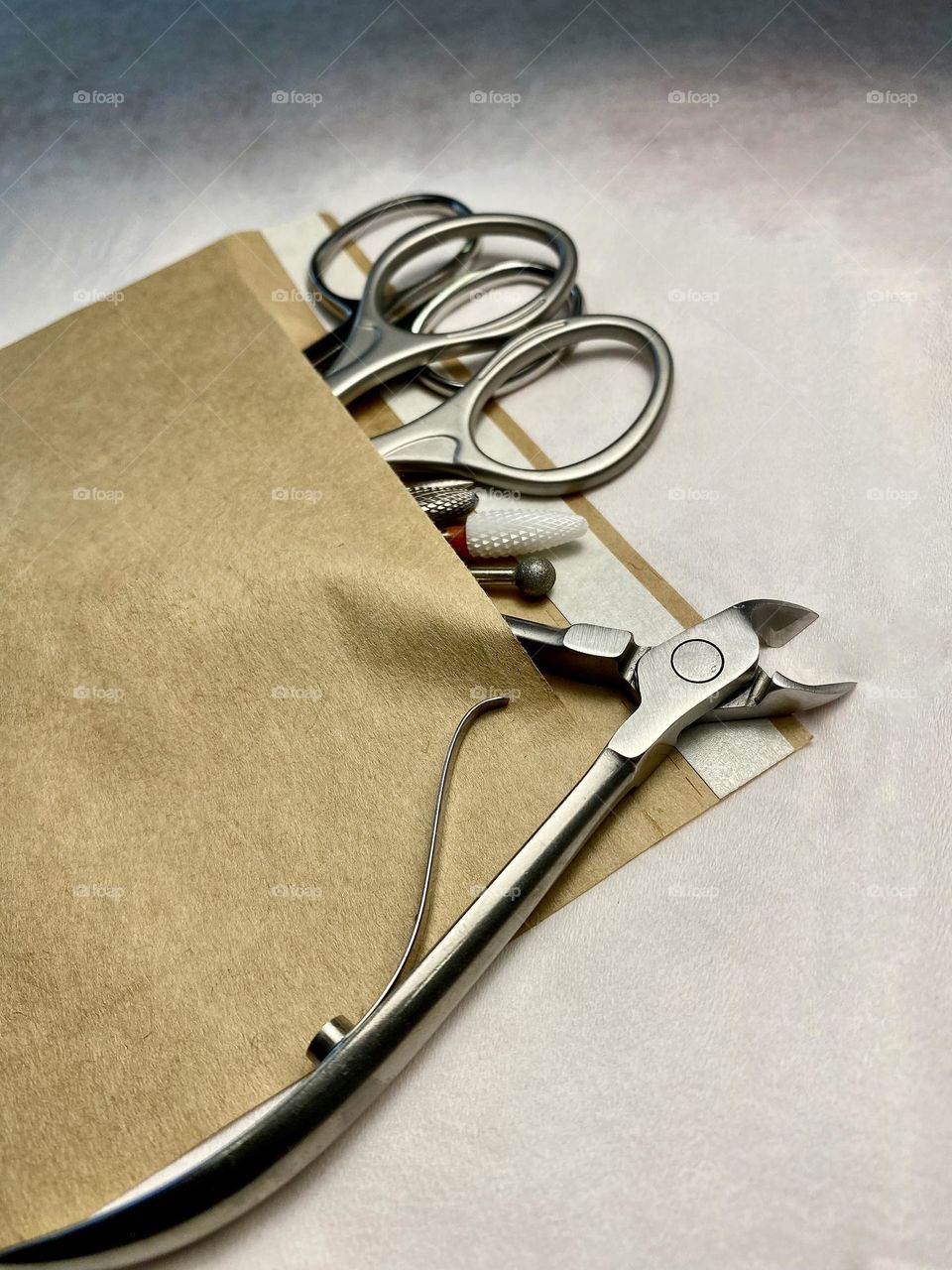 A set of tools for manicure in a craft bag.