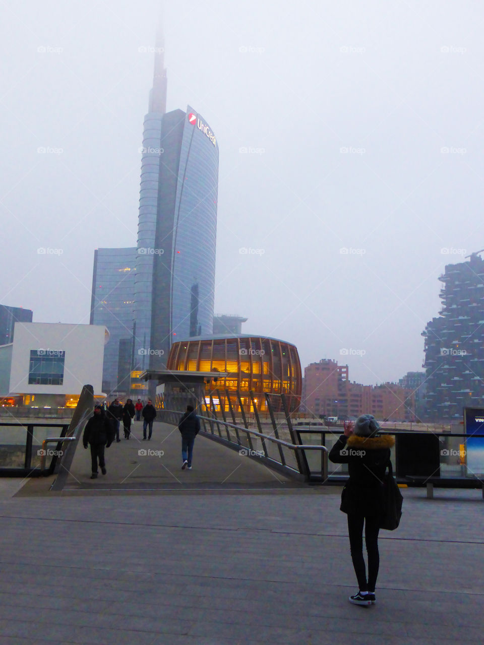 Tourists in front of the skyscrapers in Milan,Italy