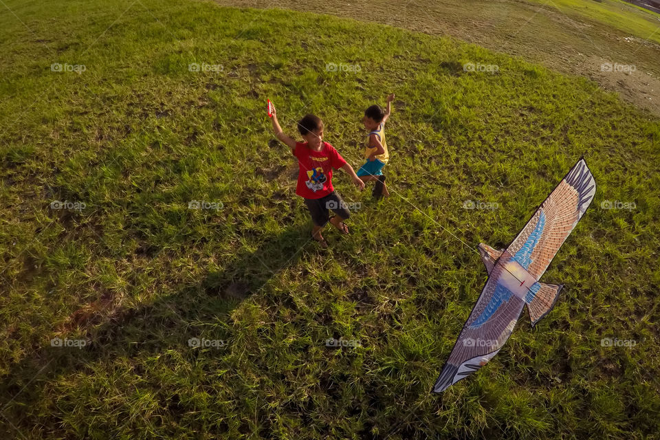 children flying kites