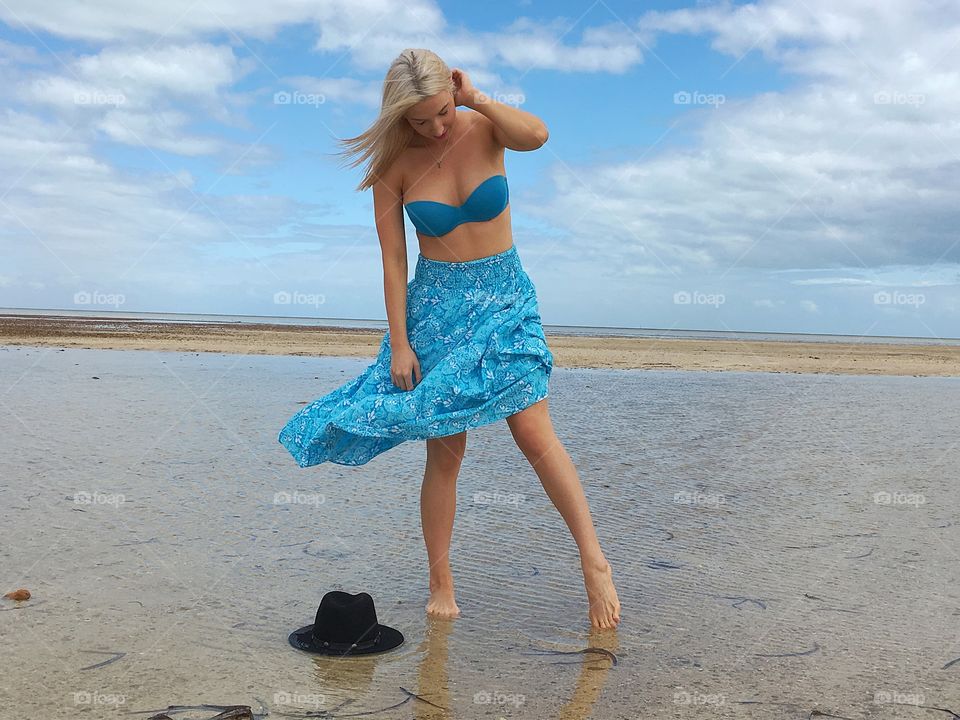 Attractive woman standing in sea