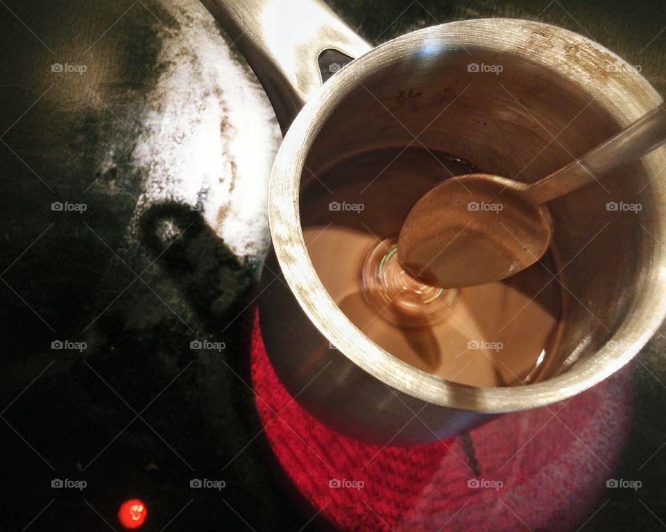 Making of hot chocolate at a grunge kitchen