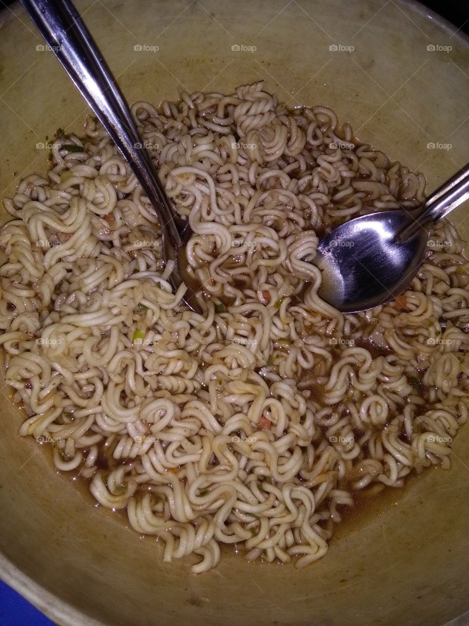 Noodles and two spoons