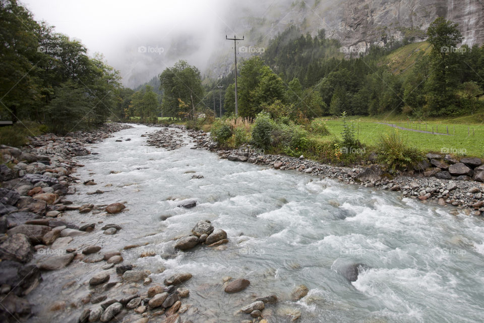 Switzerland valley, a river runs through it.