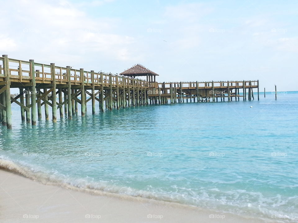 Pier in Water. While walking the coastline on Cable Beach in Bahamas, came across this brand new pier!