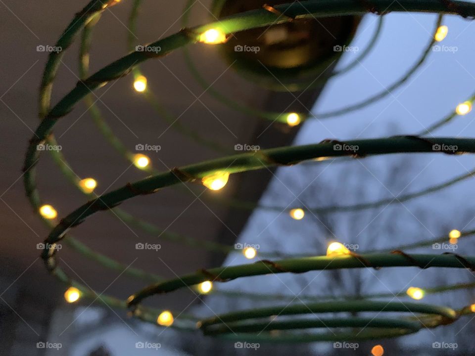 Abstract photography can include a close up of this hanging solar light, early in the morning. 