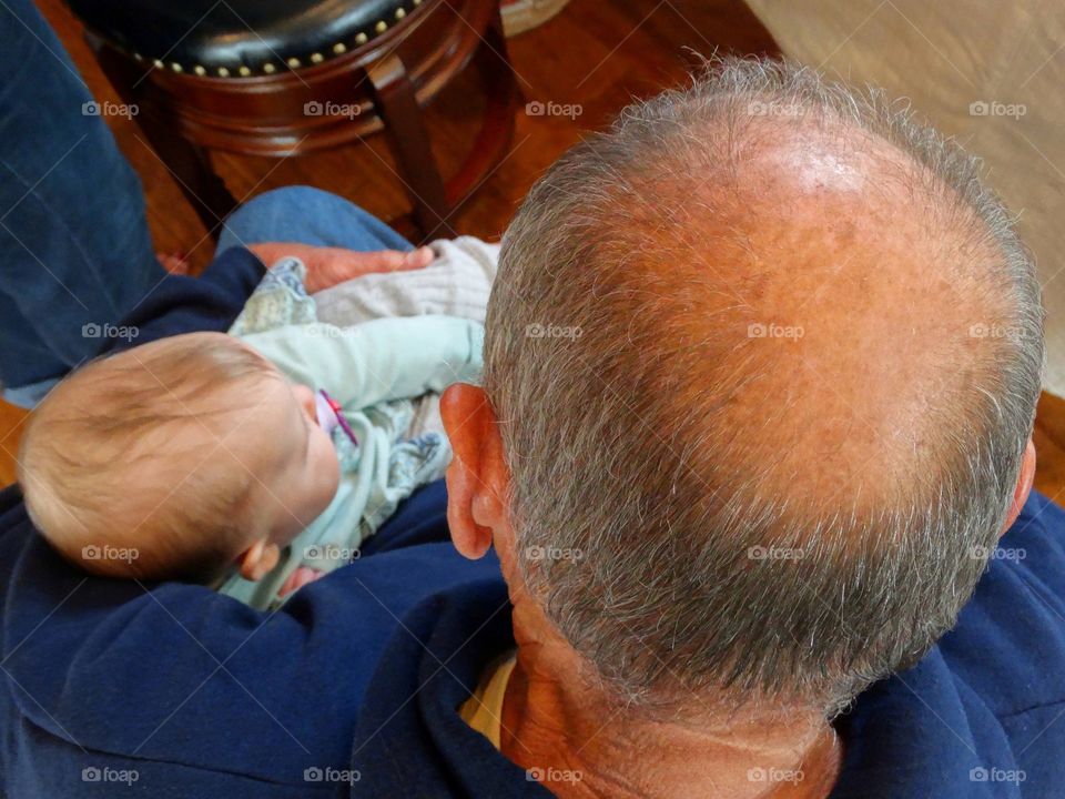 Grandpa Holding A Baby
