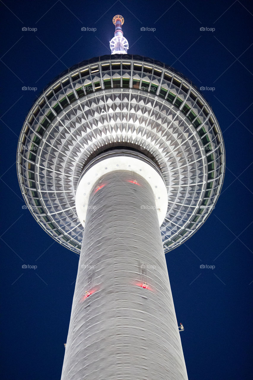 The TV Tower on the Alexanderplatz in Berlin city in Germany. Night sky view in the background.
