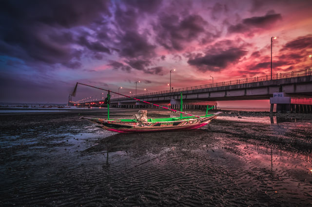 scenic view of sunrise around suramadu bridge