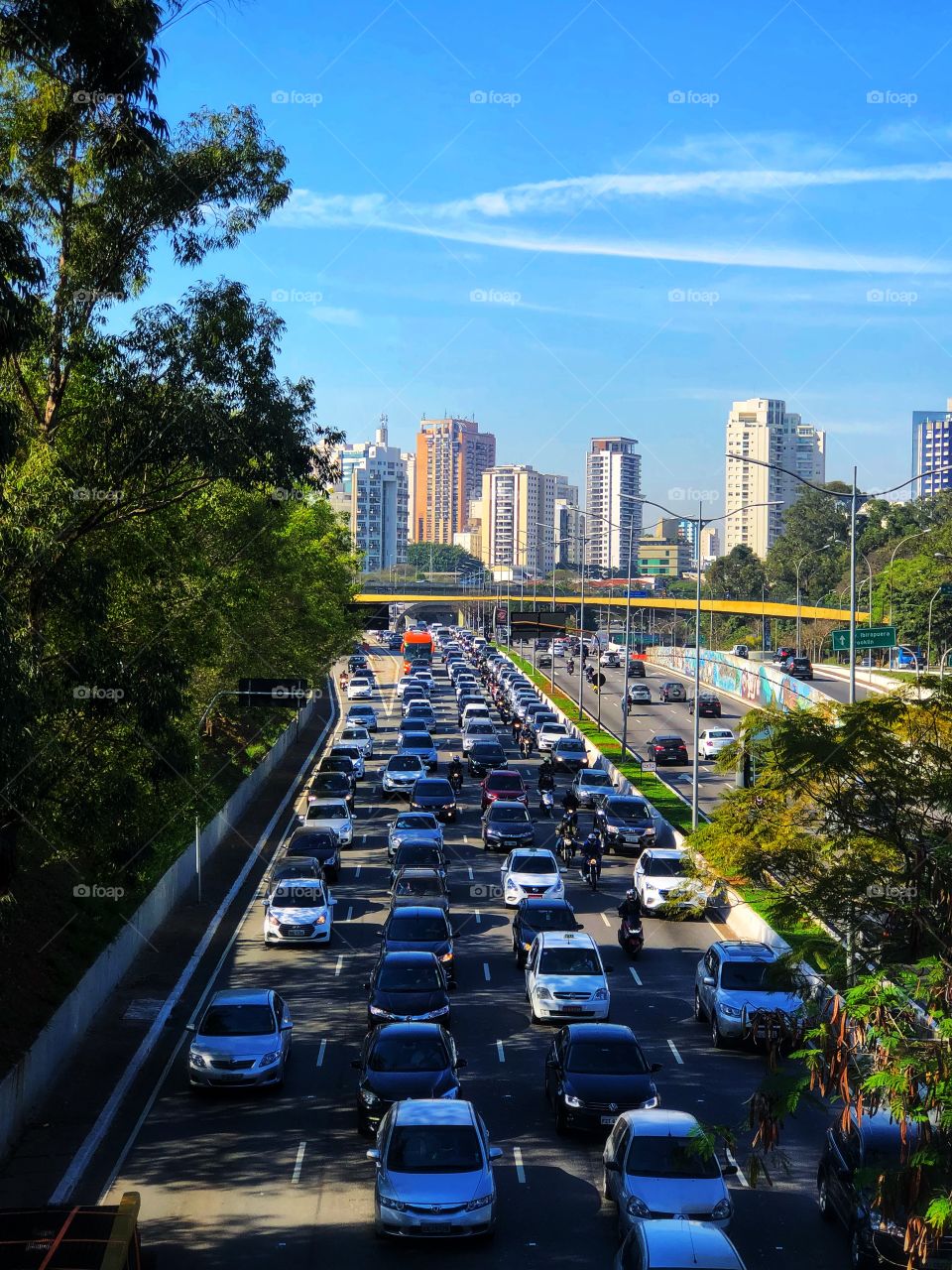 São Paulo downtown. Crossing over an important avenue, with the traffic flowing under it, and some of the buildings that make this big city in Brasil.