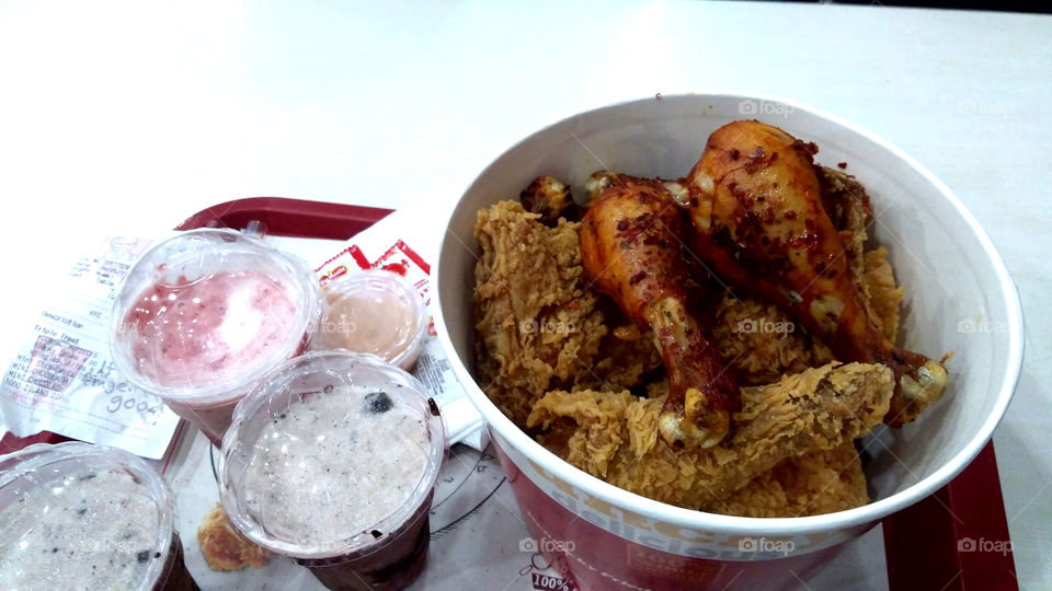 Tempting ,hot KFC. KFC bucket , smoky grilled chicken all spiced up. chicken wings,