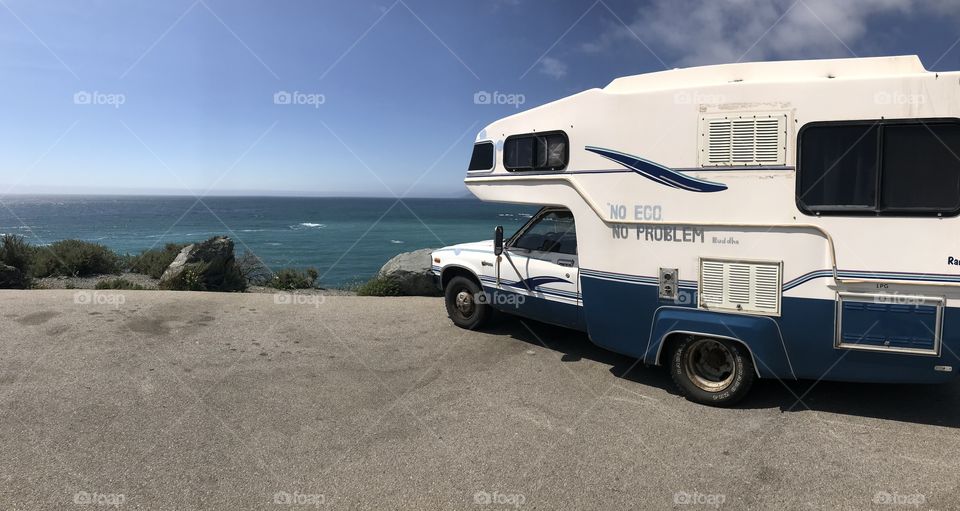 A camper van parked along the side of the highway, almost as if it’s taking in the delicate views itself. The ocean has a way of freeing the soul. 