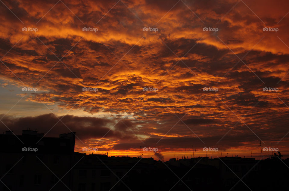 Scenic view of dramatic sky at sunset