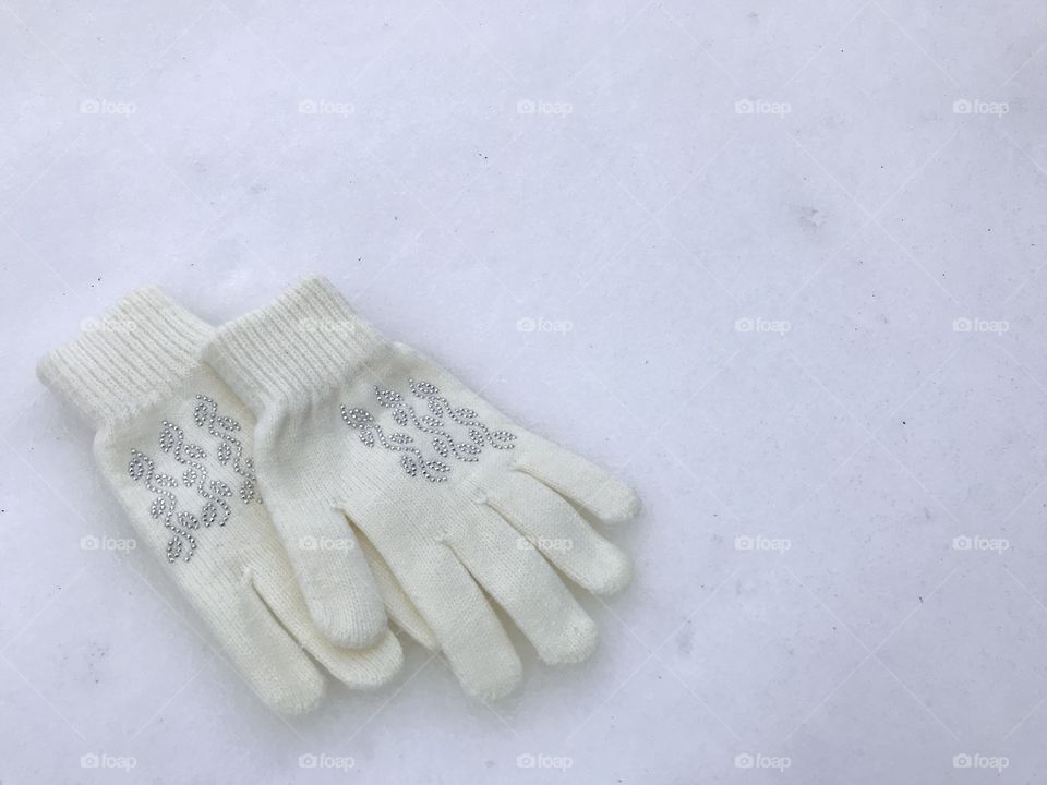 White gloves on the snow