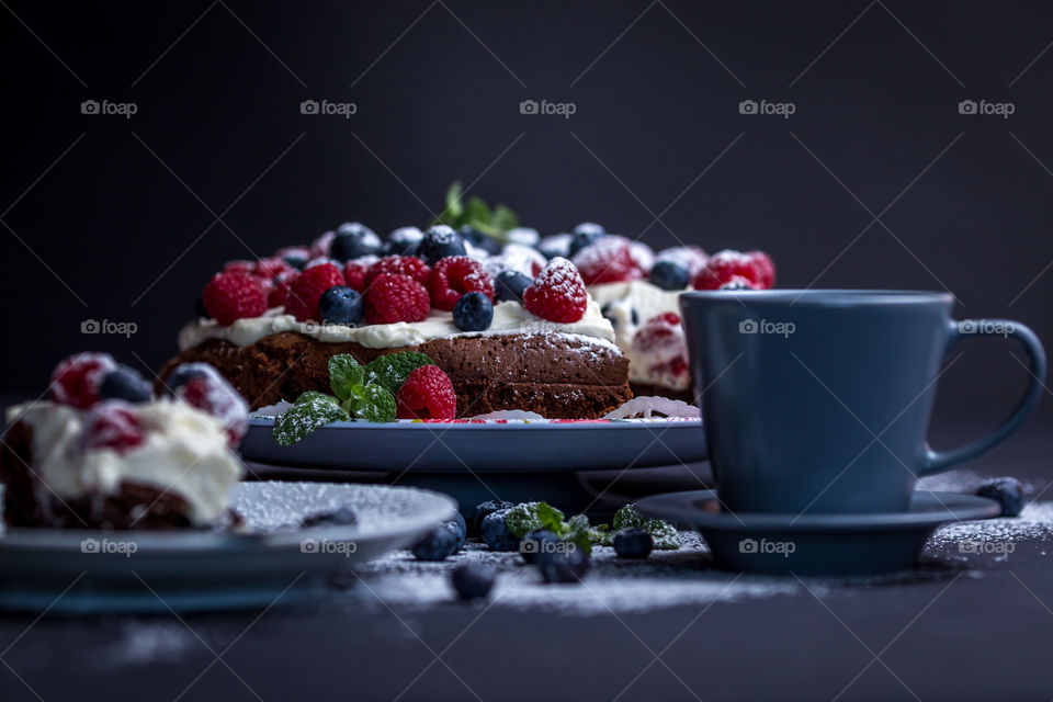 Close-up of cake with coffee cup