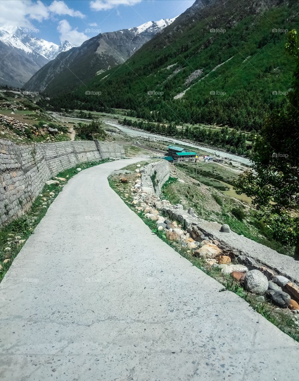A Passage To The River Surrounded By Mountains. The Road goes to the Baspa River At Chitkul in Kinnaur Valley.