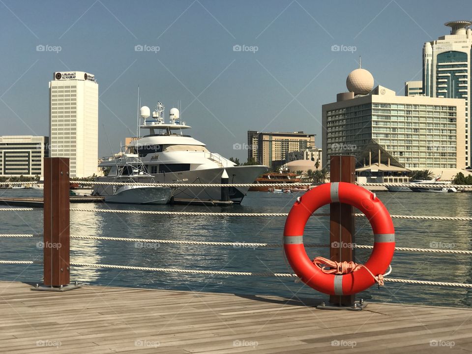 Yacht passing by the creek side in Dubai