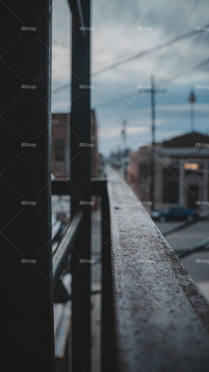 Steel ladder and rail off into the city 
