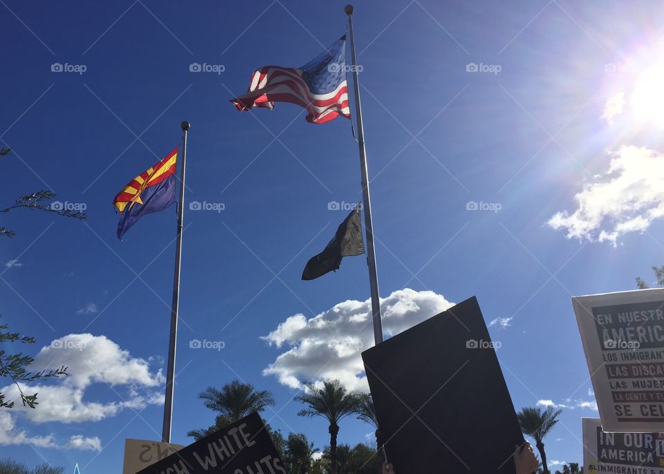 January 21, 2017. Flags wave in the wind in Phoenix, Arizona during the Women's March on Washington.
