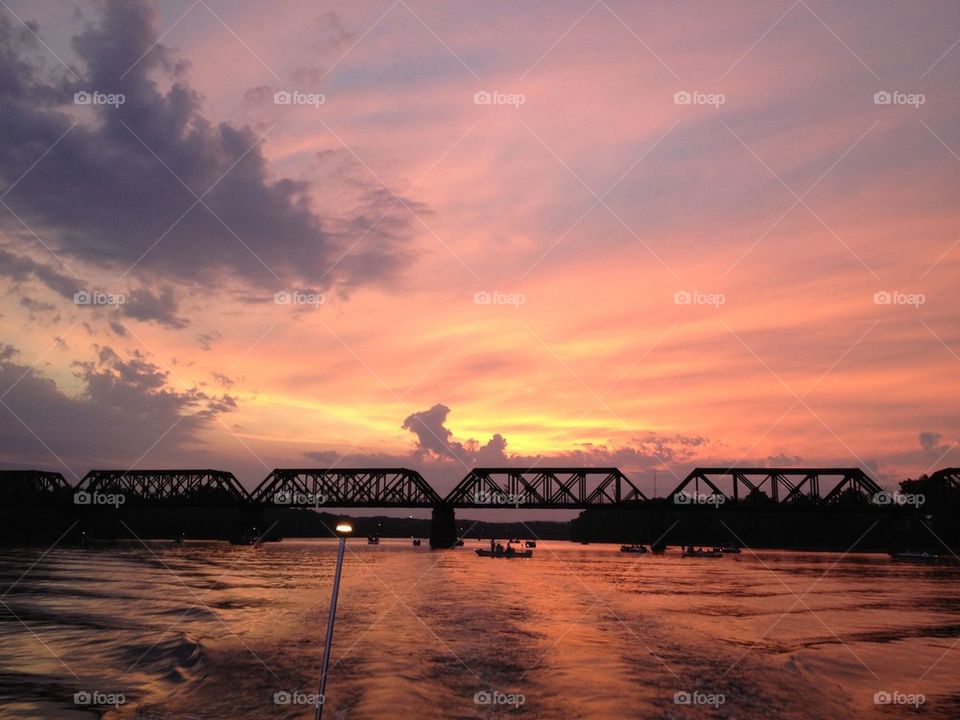 Rail Bridge at Sunset on River